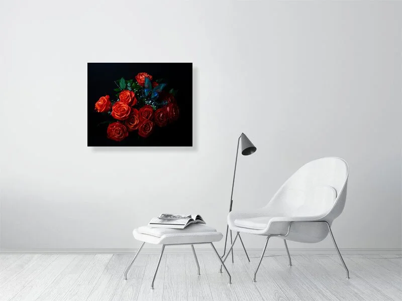 Fine art photograph of an iridescent blue butterfly perched on a bouquet of orange roses for sale sample of home decor.