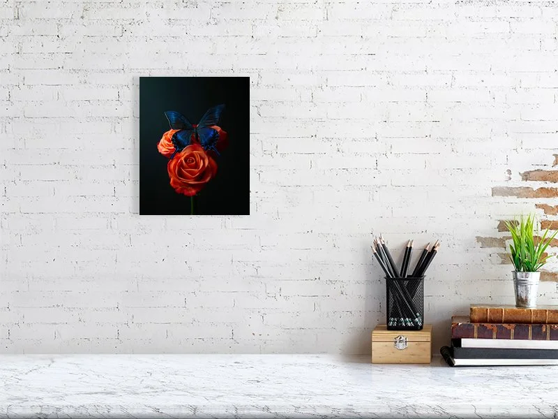 Fine art prints for sale of an iridescent blue butterfly sitting on a bunch of three orange roses.