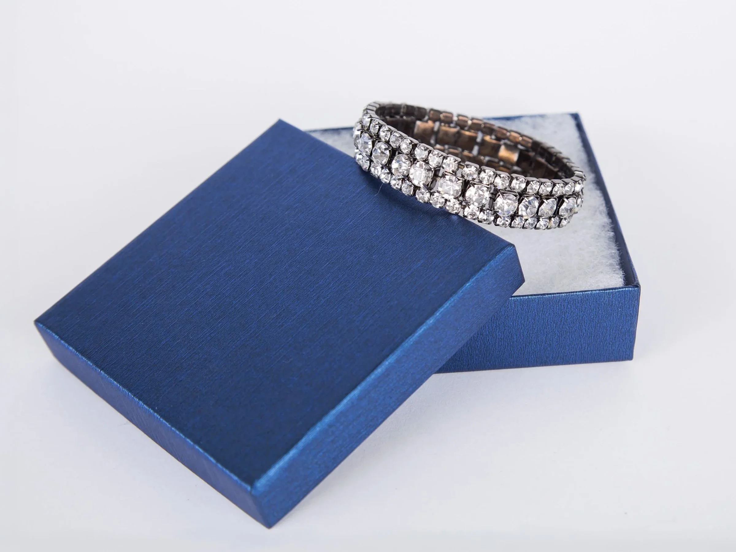 Product image of a 1940s style vintage rhinestone bangle bracelet set in a little blue box. 