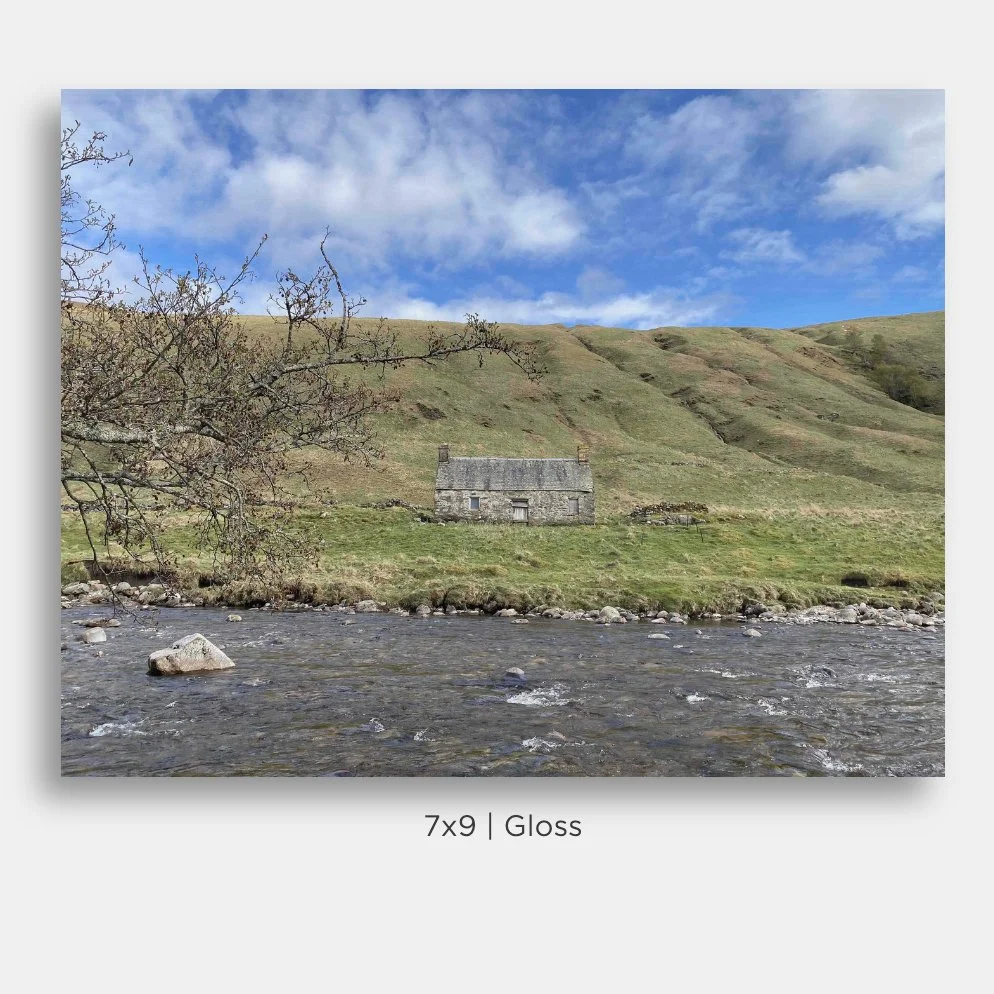 Landscape of a stone cottage on the bank of the River Tilt in the hills of Glen Tilt, in Perthshire, Scotland. Prints for sale.