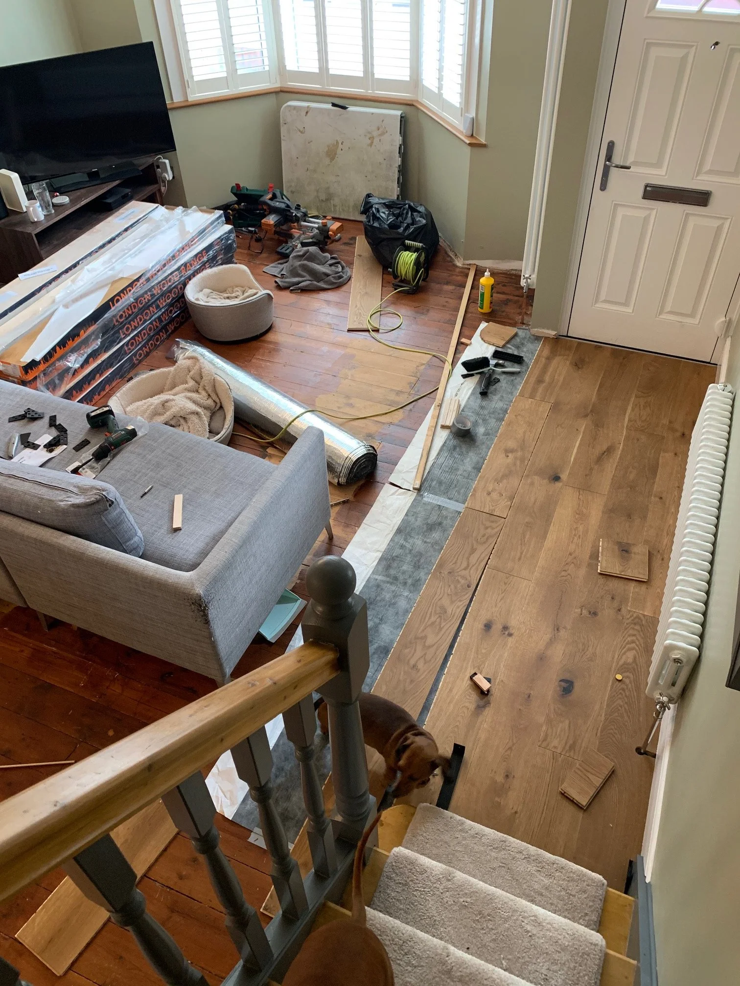 Living room redesign Uxbridge. A couple of walls were removed, leaving a large open plan room. The floors were all sanded and varnished initially. Interior design scheme was agreed and we went on to paint all the walls and cieling. Install coving and