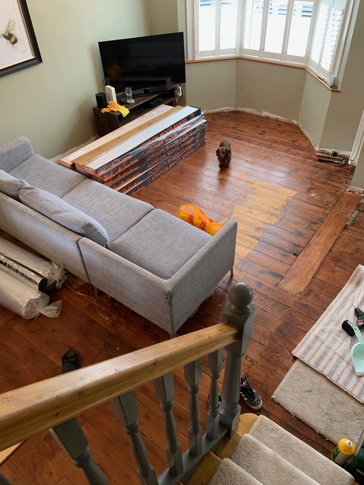 Living room redesign Uxbridge. A couple of walls were removed, leaving a large open plan room. The floors were all sanded and varnished initially. Interior design scheme was agreed and we went on to paint all the walls and cieling. Install coving and