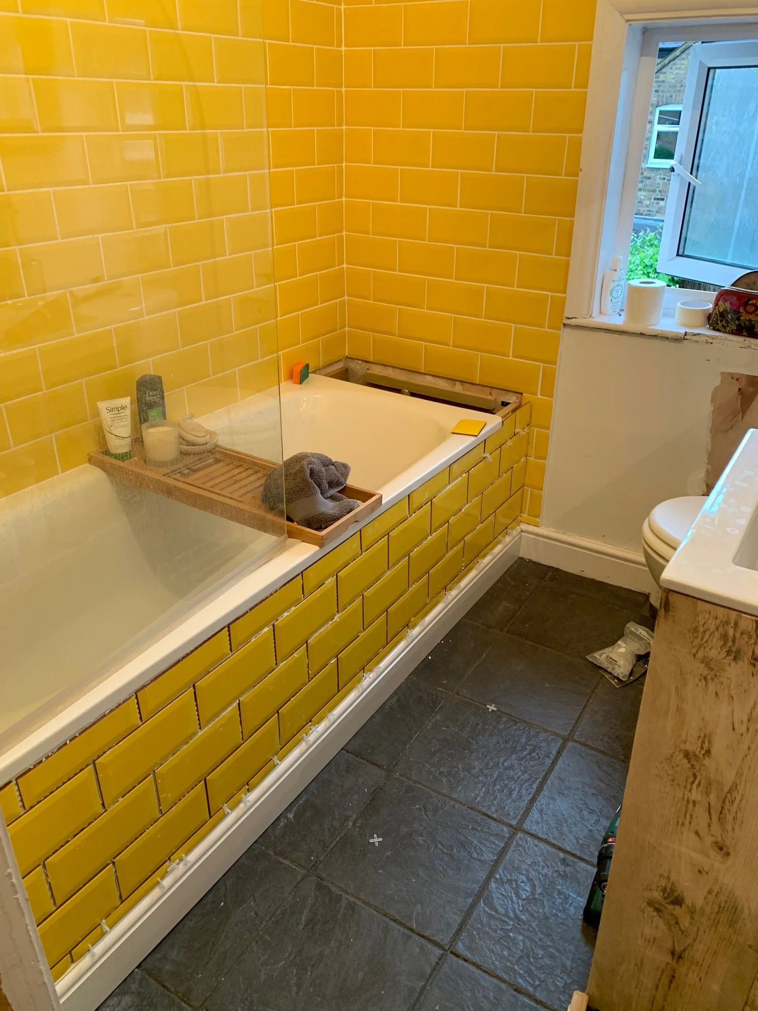 Bathroom Refurbishment Uxbridge. Rip out, relocate the toilet and sink. Light plumbing. Tiling.