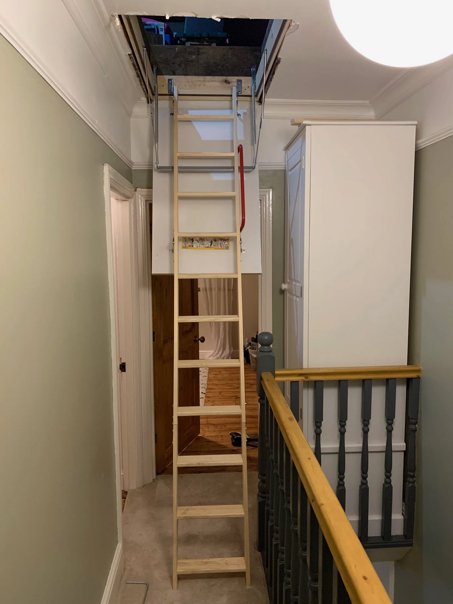 Landing Refurbishment. Painting, coving, skirting boards, sanding and painting the stairs. Ceiling rose. New doors sanded and varnished. New loft hatch.