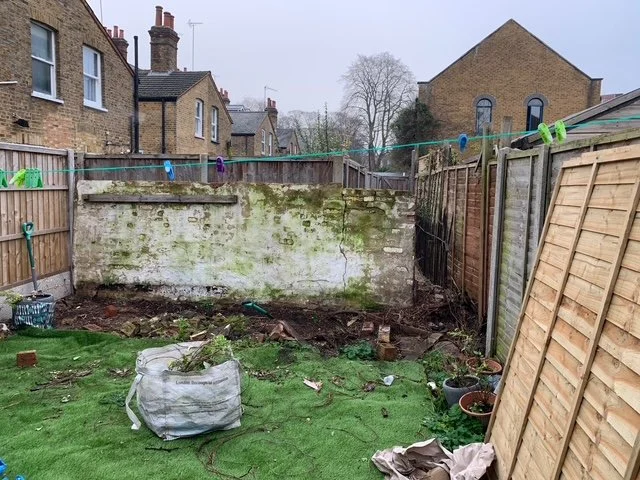 Overgrown garden. Clearout. old wall removal.