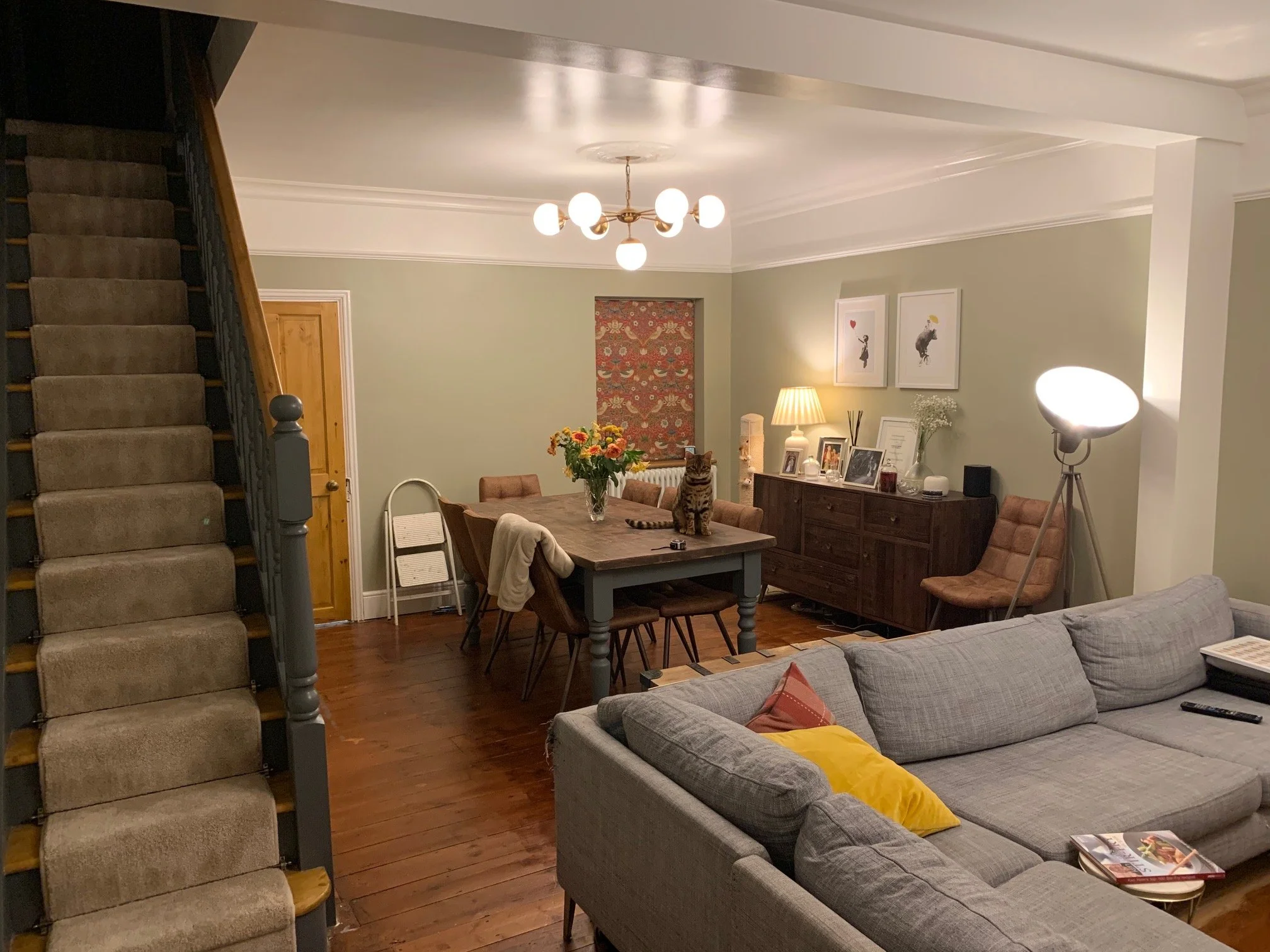 Living room redesign Uxbridge. A couple of walls were removed, leaving a large open plan room. The floors were all sanded and varnished initially. Interior design scheme was agreed and we went on to paint all the walls and cieling. Install coving and