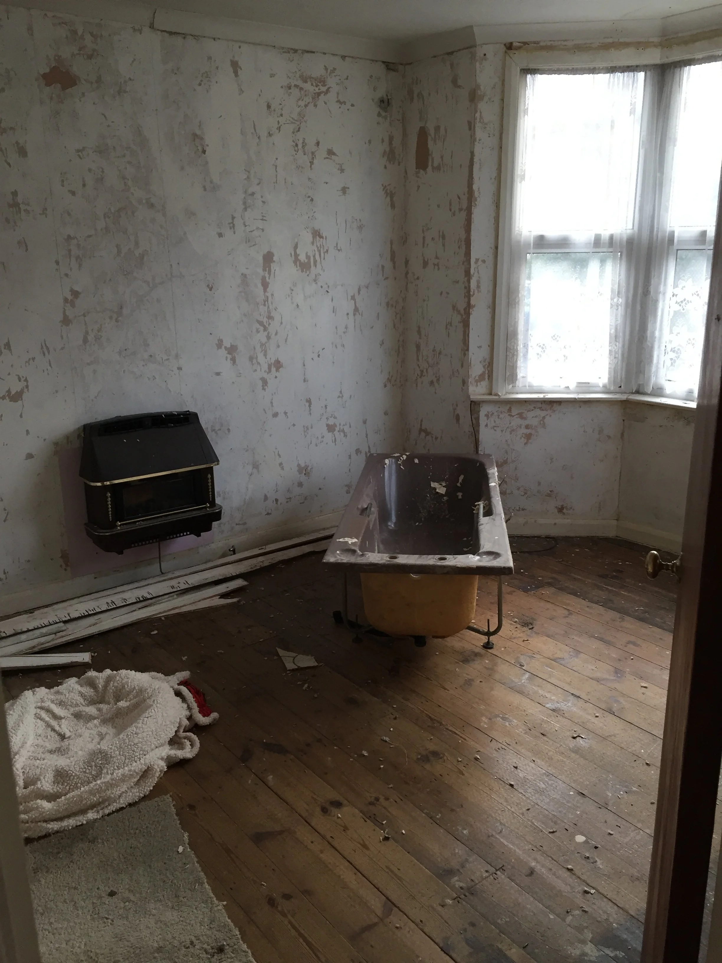 Living room redesign Uxbridge. A couple of walls were removed, leaving a large open plan room. The floors were all sanded and varnished initially. Interior design scheme was agreed and we went on to paint all the walls and cieling. Install coving and