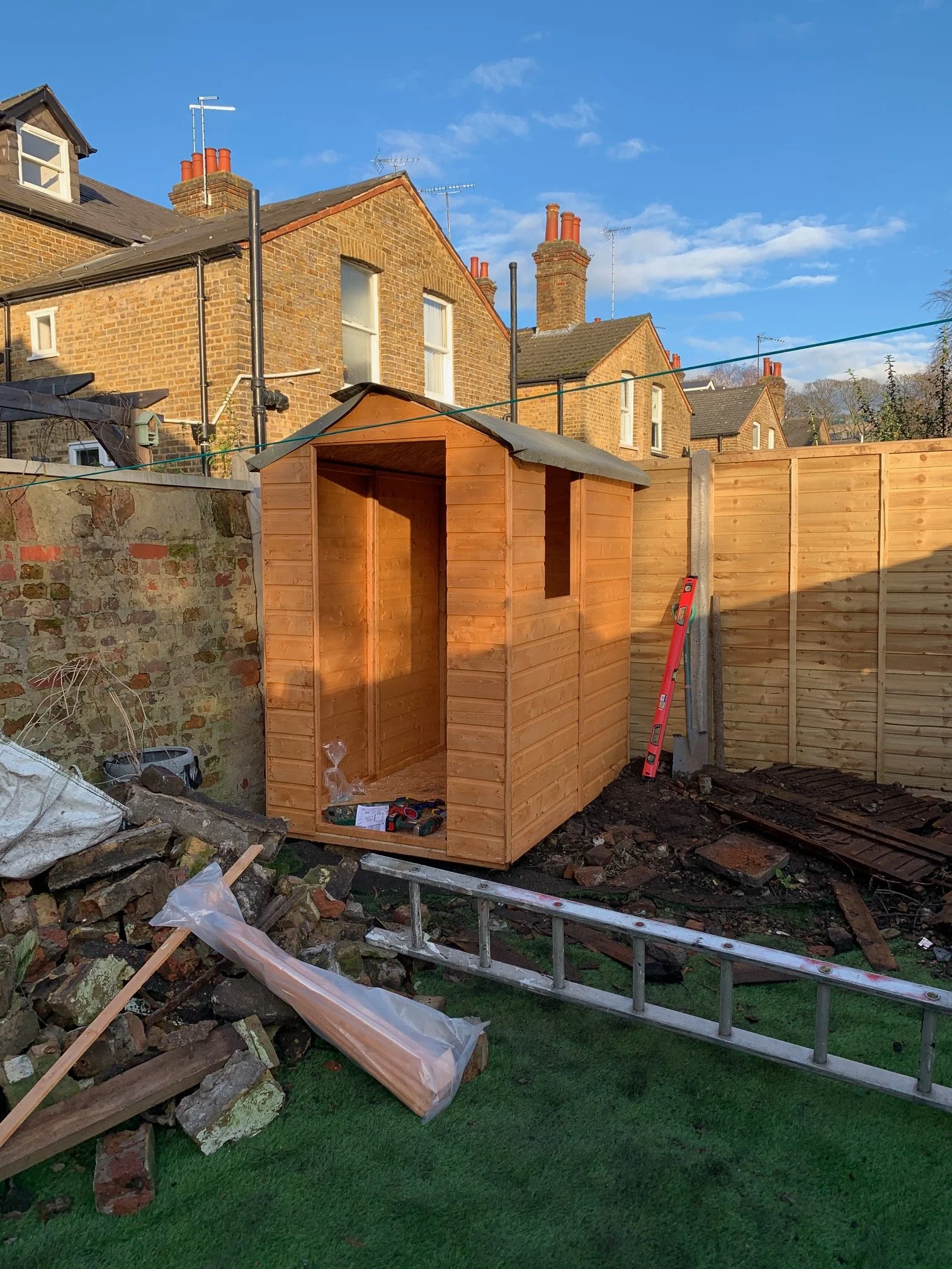 Overgrown garden. Shed building