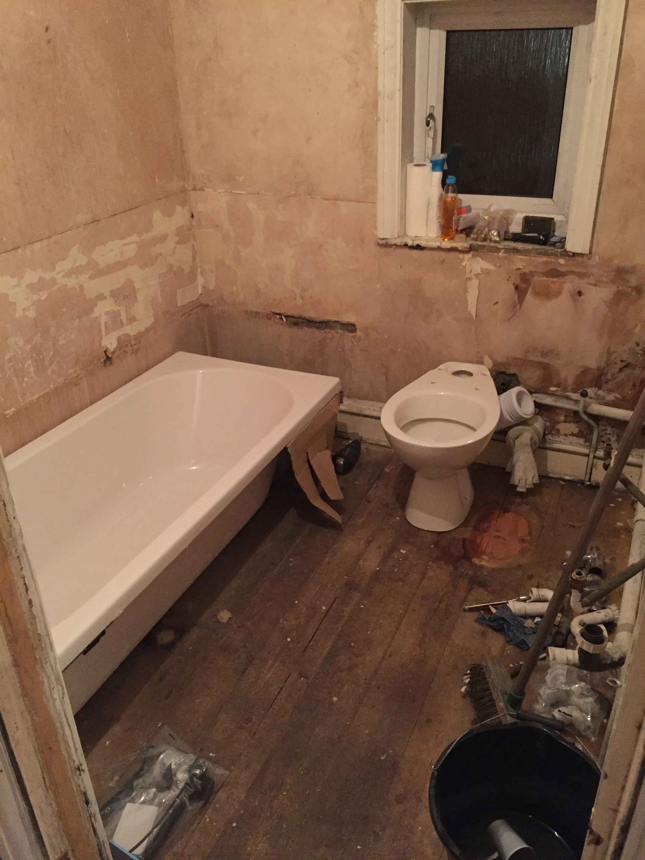 Bathroom Refurbishment Uxbridge. Rip out, relocate the toilet and sink. Light plumbing.