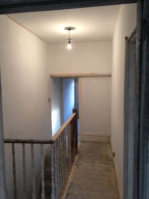 Landing Refurbishment. Painting, coving, skirting boards, sanding and painting the stairs. Ceiling rose. New doors sanded and varnished.