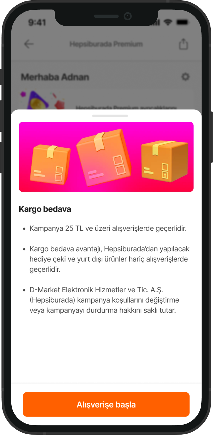 A mobile phone screen showing a promotional offer for free shipping on orders over 25 TL, with a button labeled 'Start Shopping'. The screen features three illustrated shopping boxes in orange and yellow on a pink background.