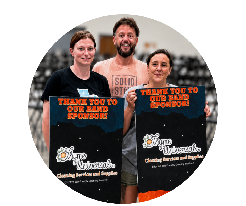 Three people standing indoors holding signs that thank their band sponsor, Thyme Universal Cleaning Services and Supplies.