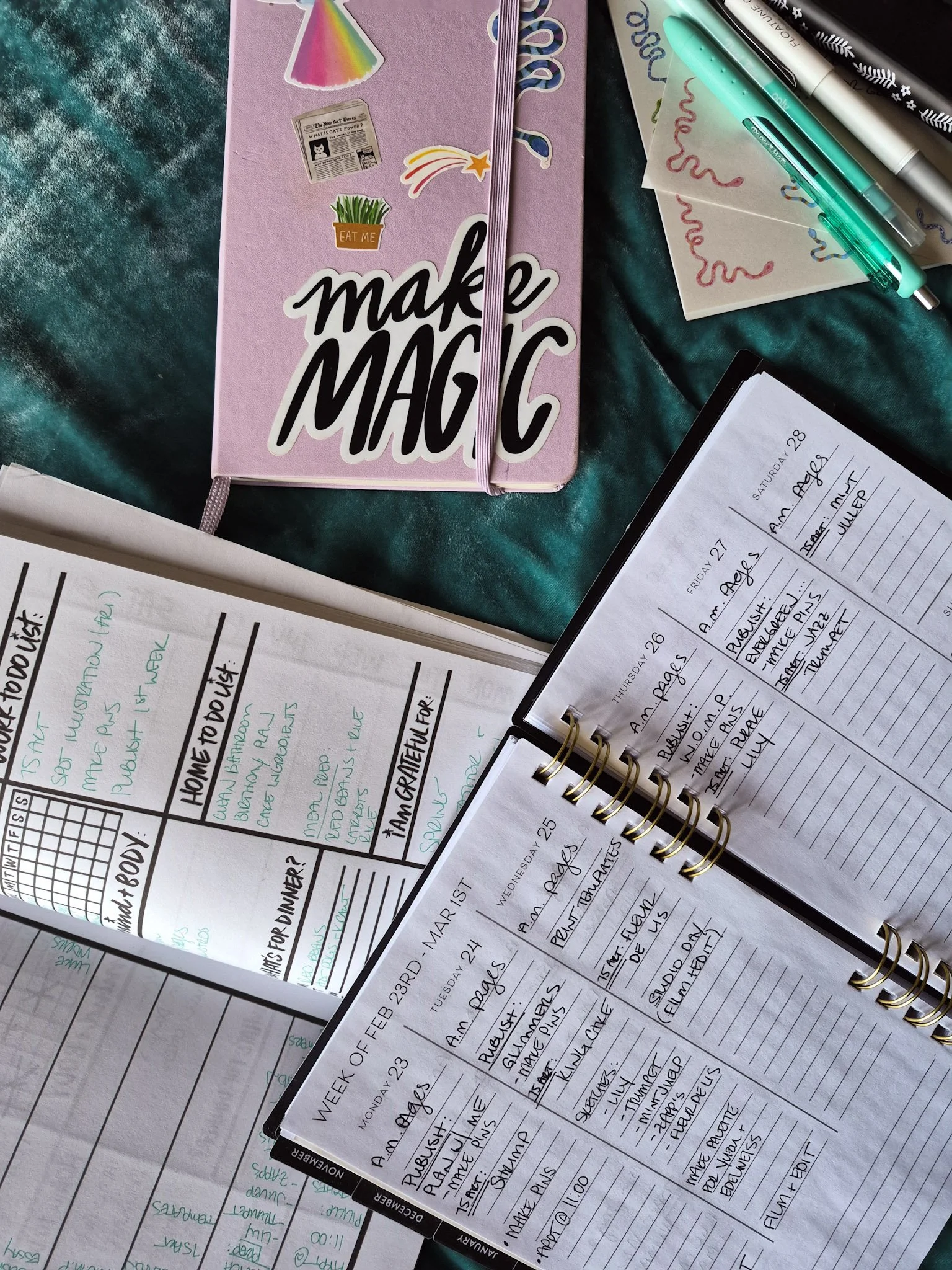 weekly planning spread with planner journal and notepad