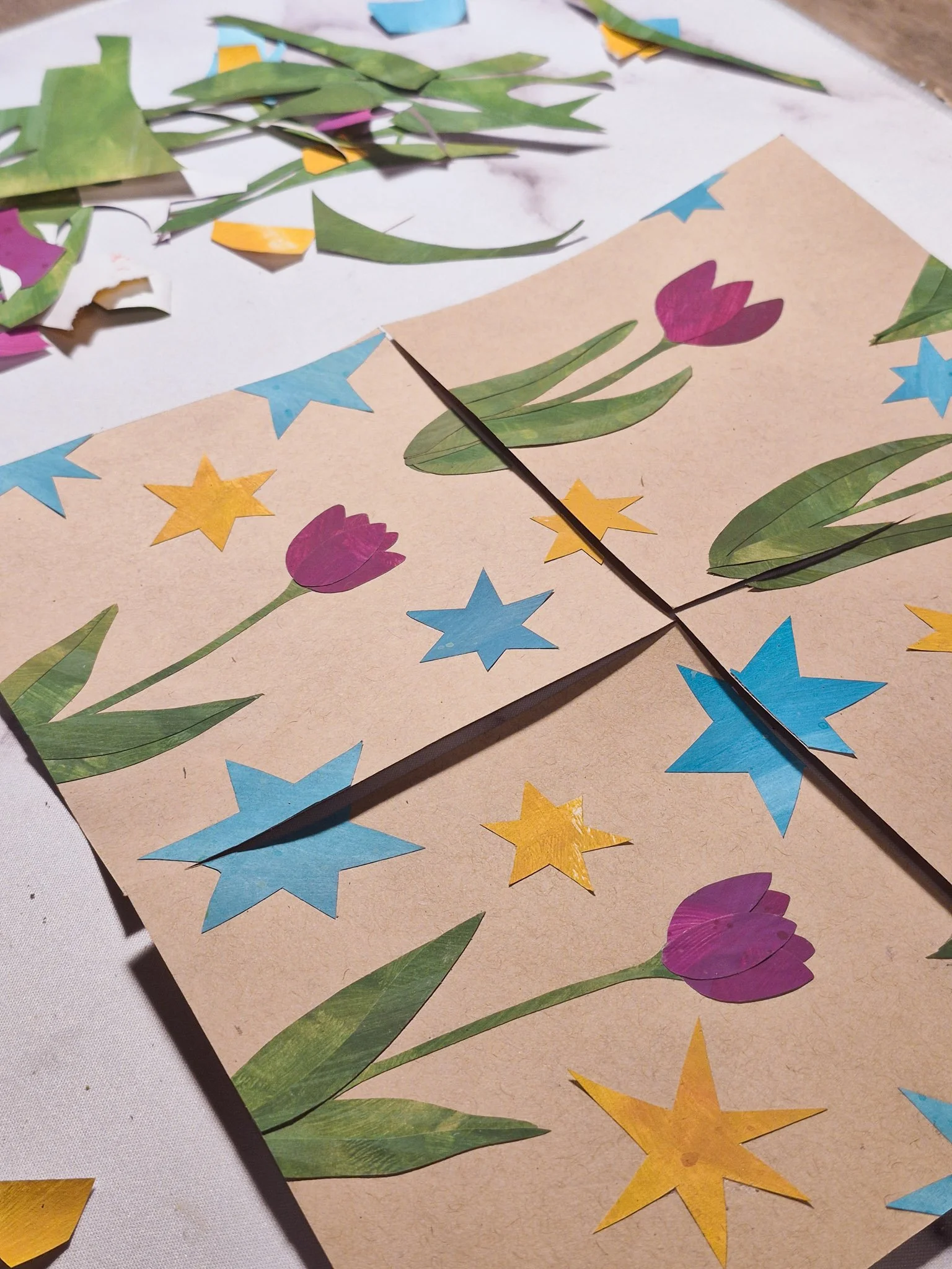 desk shot of an in progress painted paper collage repeating pattern