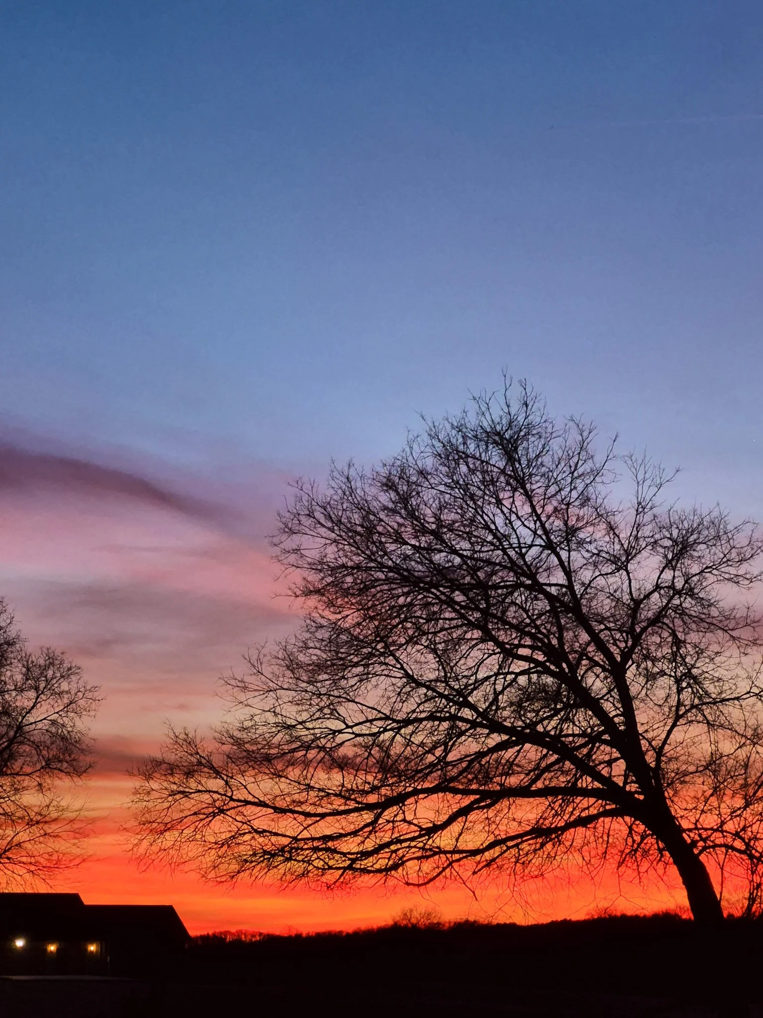 fiery sunset in colors of deep red orange pink and lavender