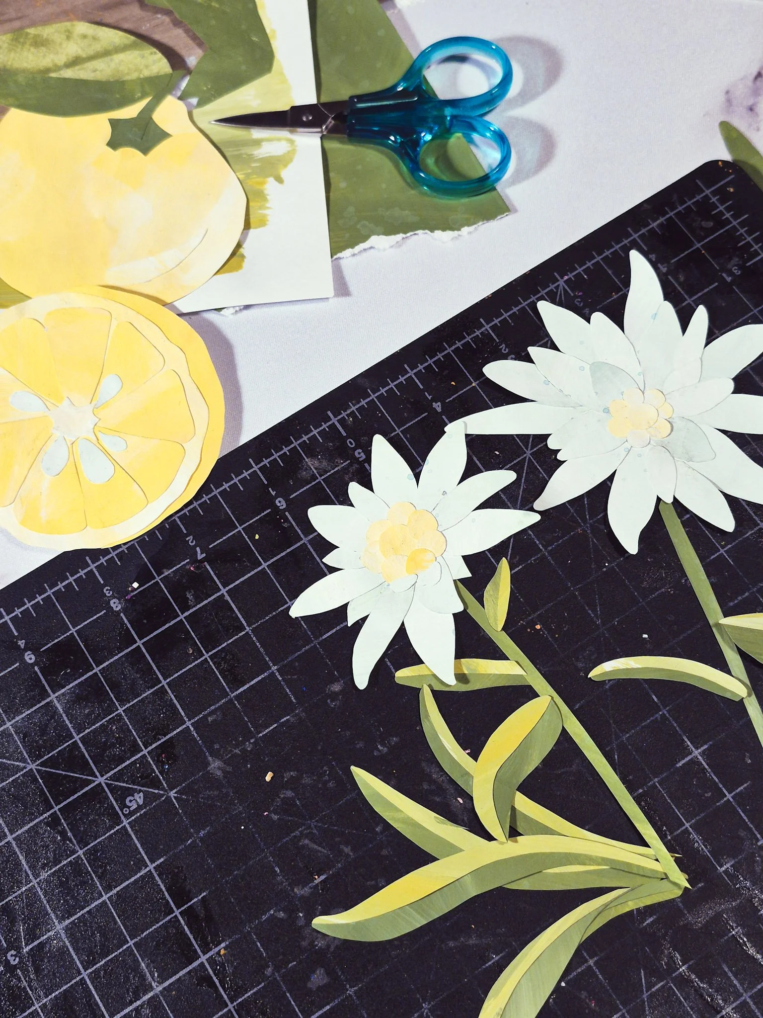 work in progress of edelweiss and yuzu papercut collage illustrations