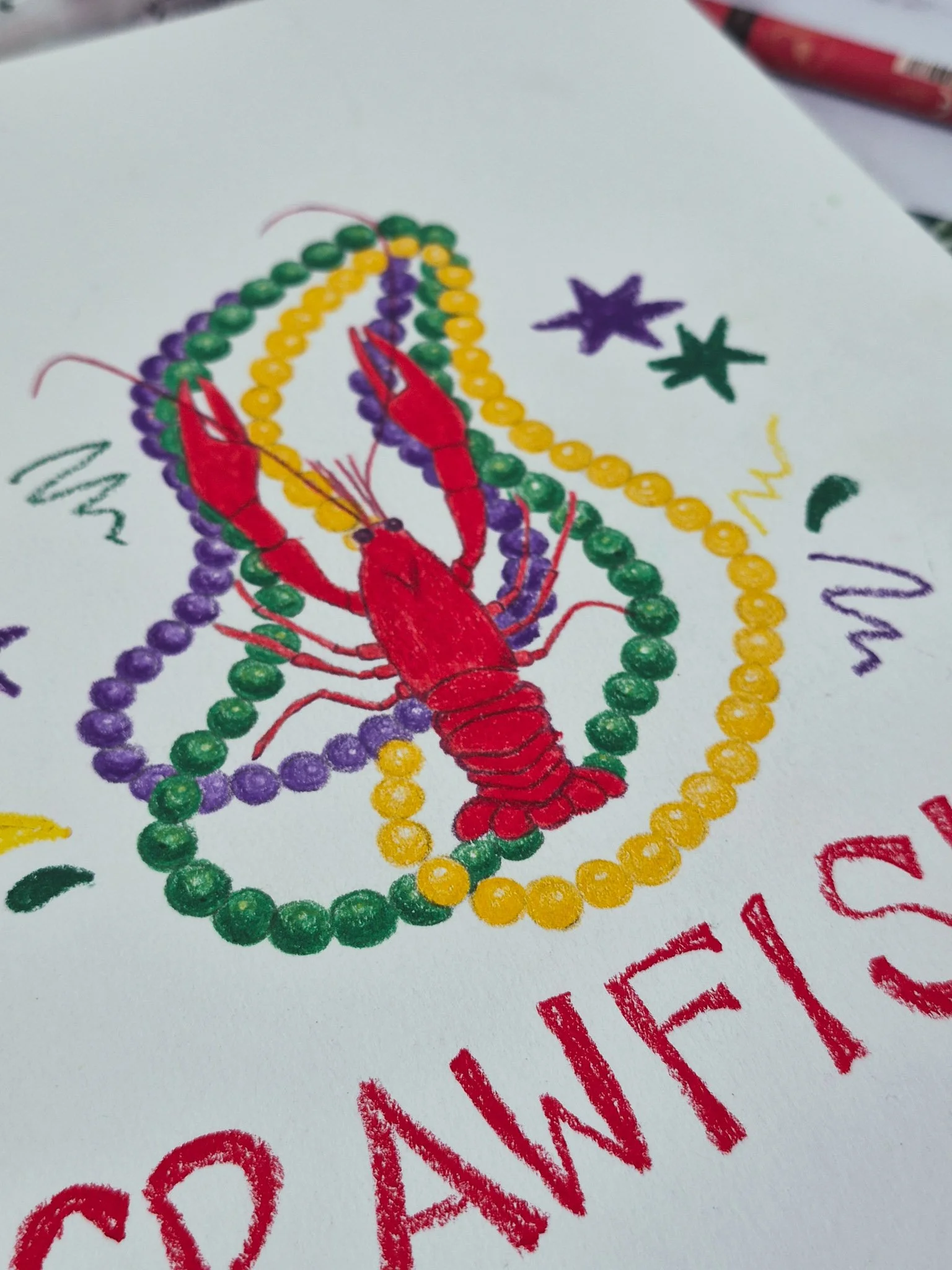 closeup of finished crawfish with mardi gras beads drawing for 75 Art challenge