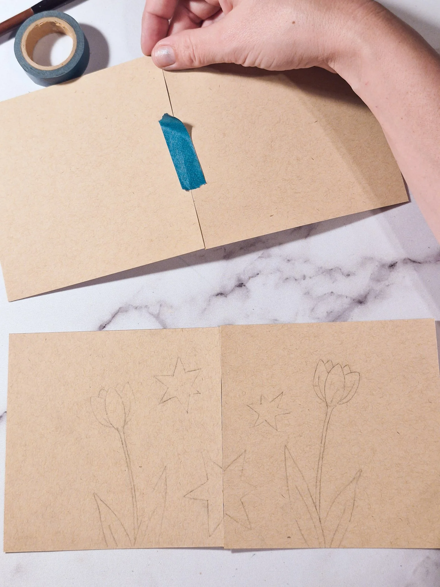 top two paper squared separated and rearranged, showing a top to bottom swap in the repeat pattern process.