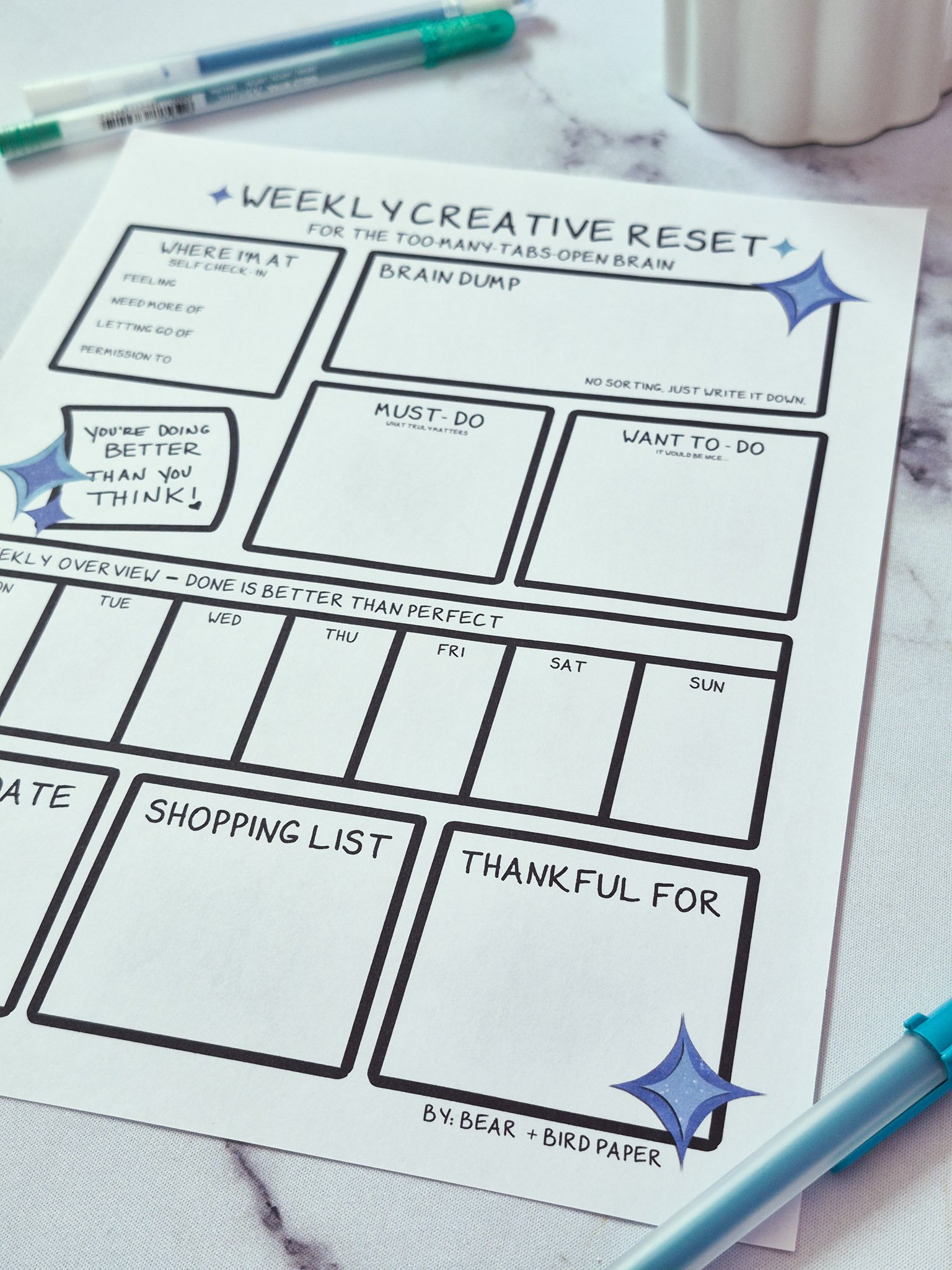 Close-up of weekly planning printable with brain dump and must-do task sections