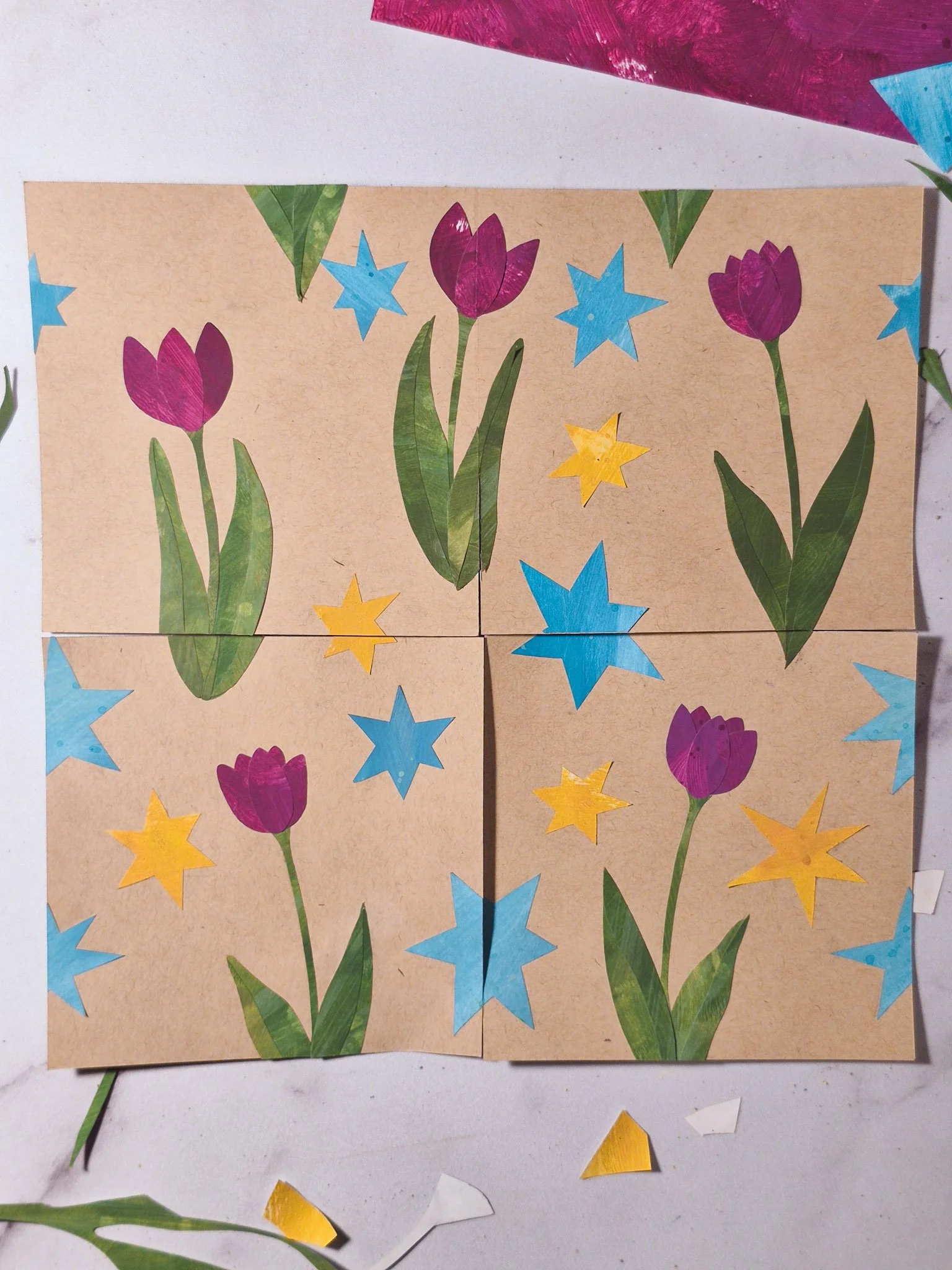 A finished analog repeat pattern created with hand-cut paper collage pieces arranged into a seamless design