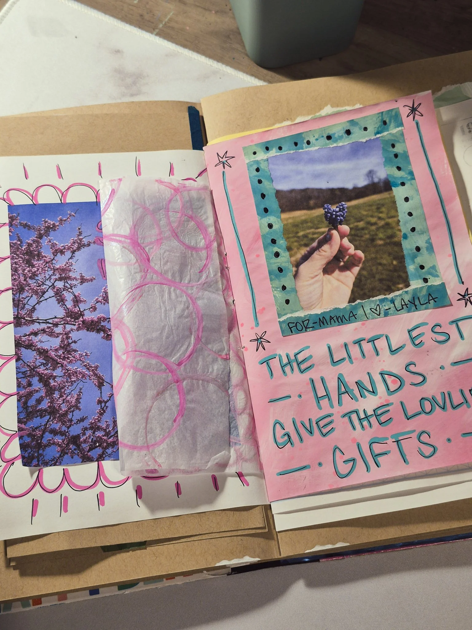 Cozy creative workspace with painted paper, collage tools, and slow art process