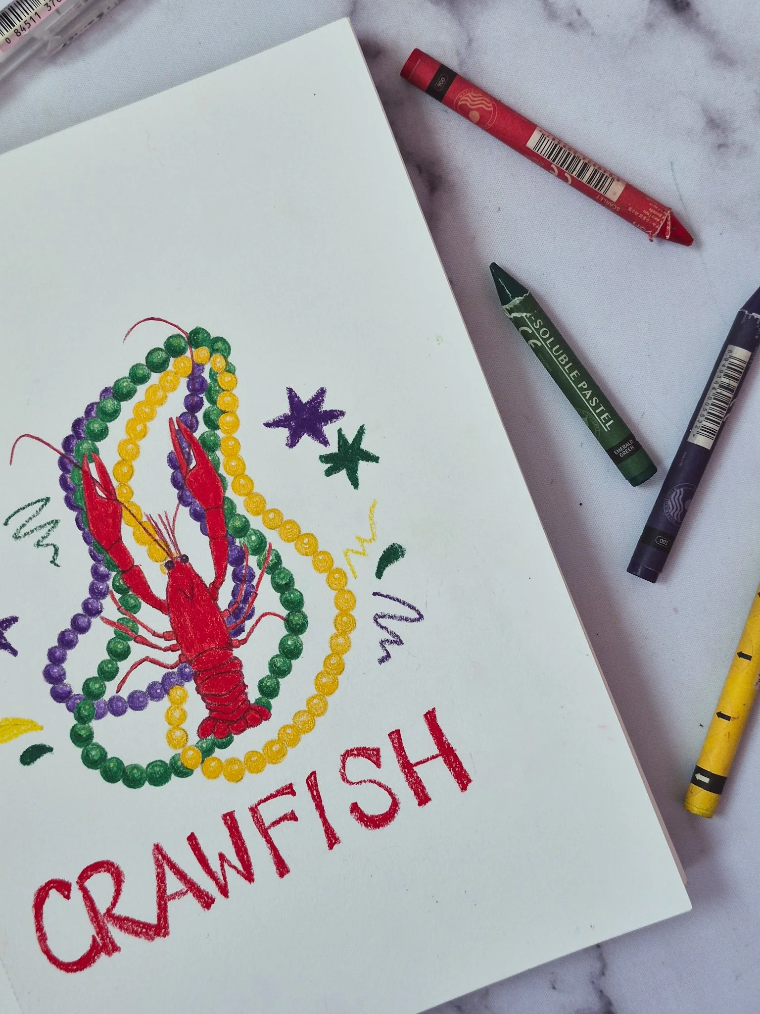 overhead image of 75 art illustration of a red crawfish with purple green and yellow mardi gras beads in the background