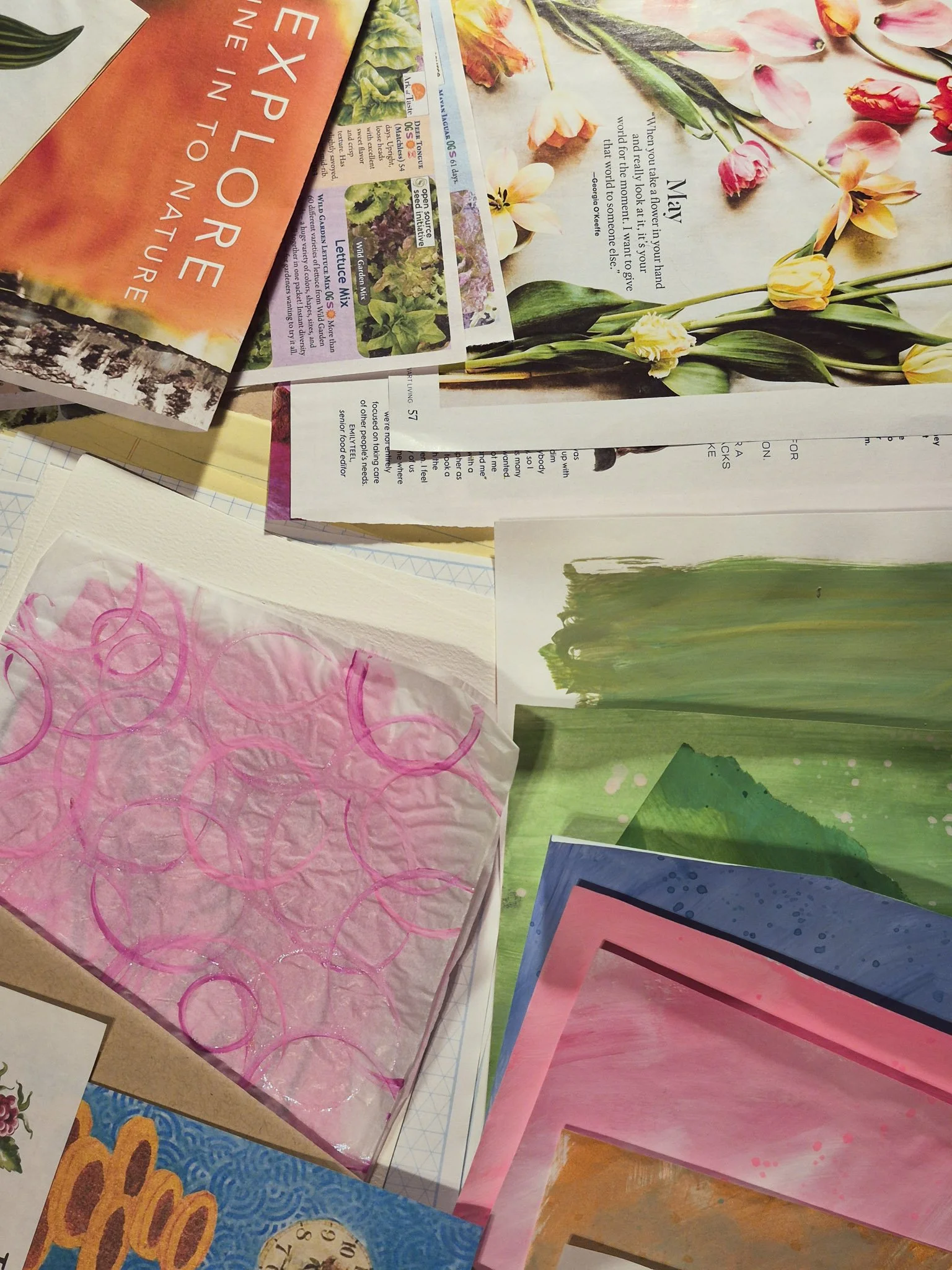 flat lay of scrap papers from magazines, books and other ephemera for assembling into a handmade junk journal