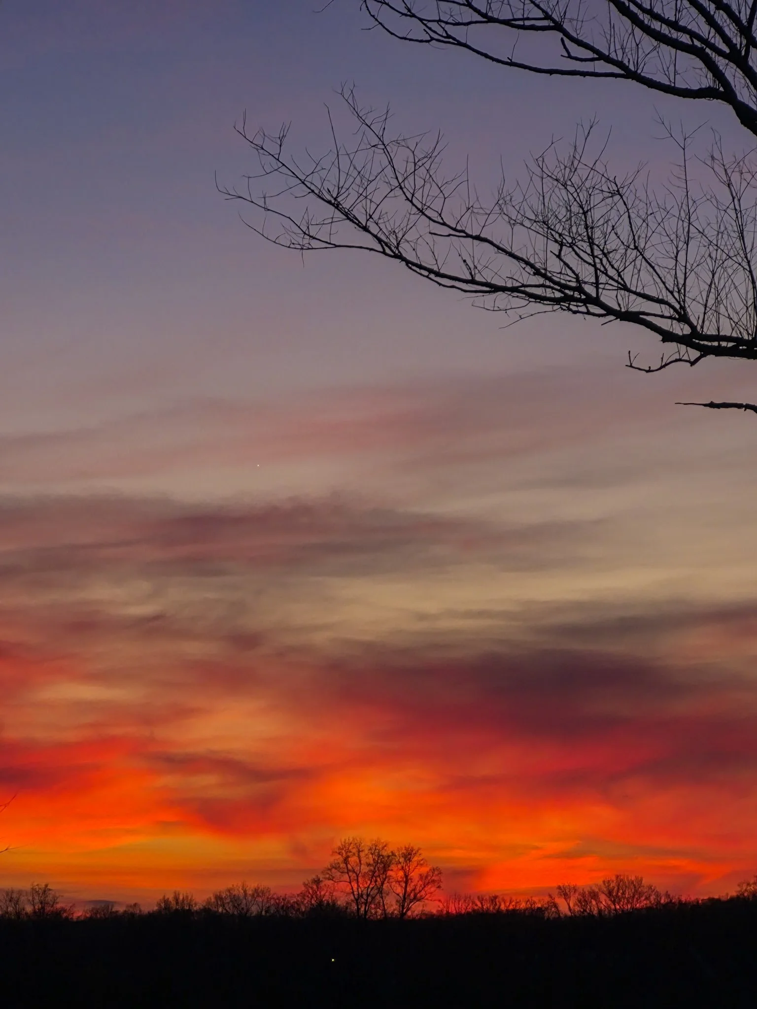 sky check shot of a late winter sunset in colors of bright red, orange and lavender