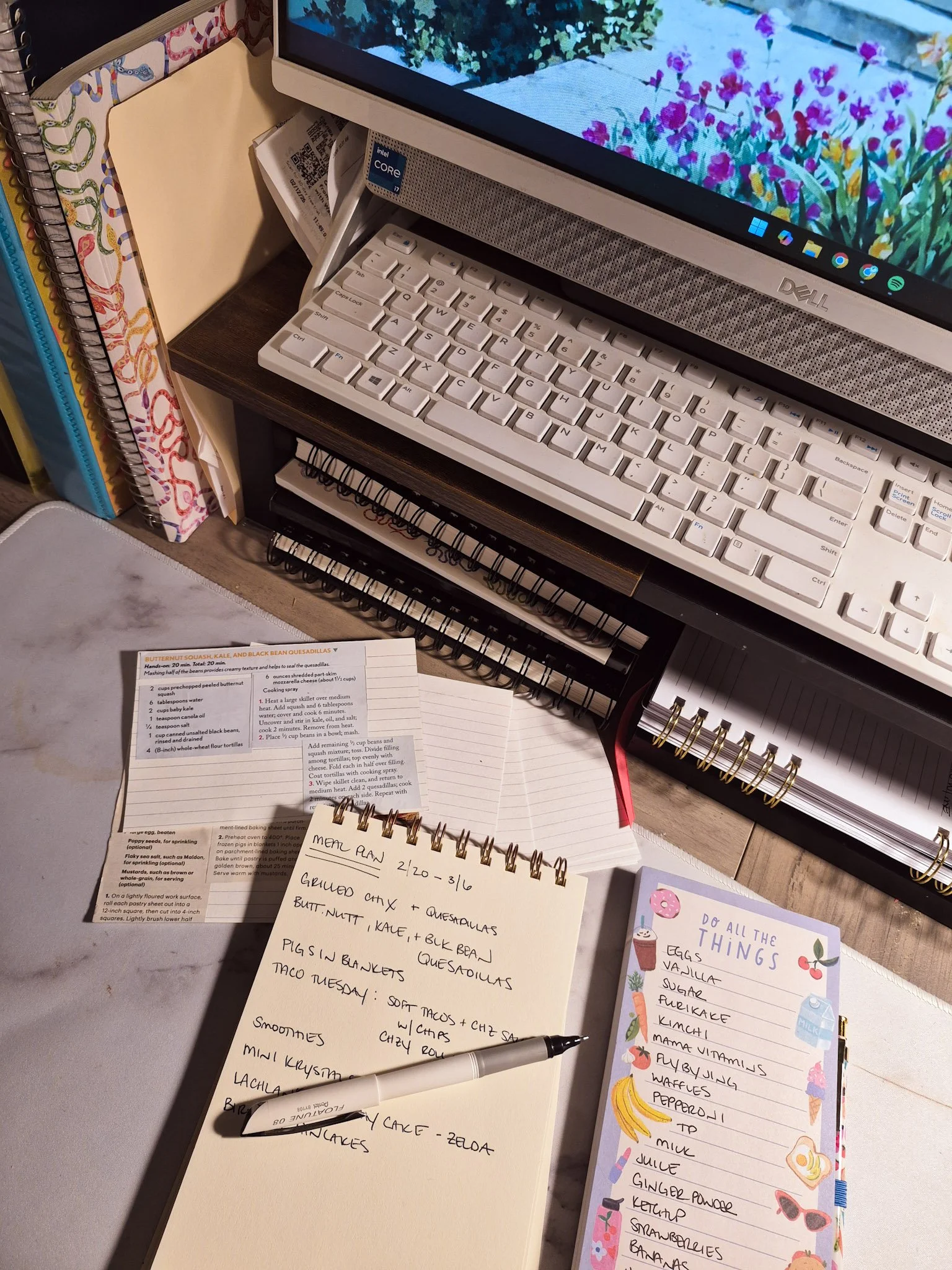 desktop shot of notepad with meal plan and snack ideas and recipe cards nearby
