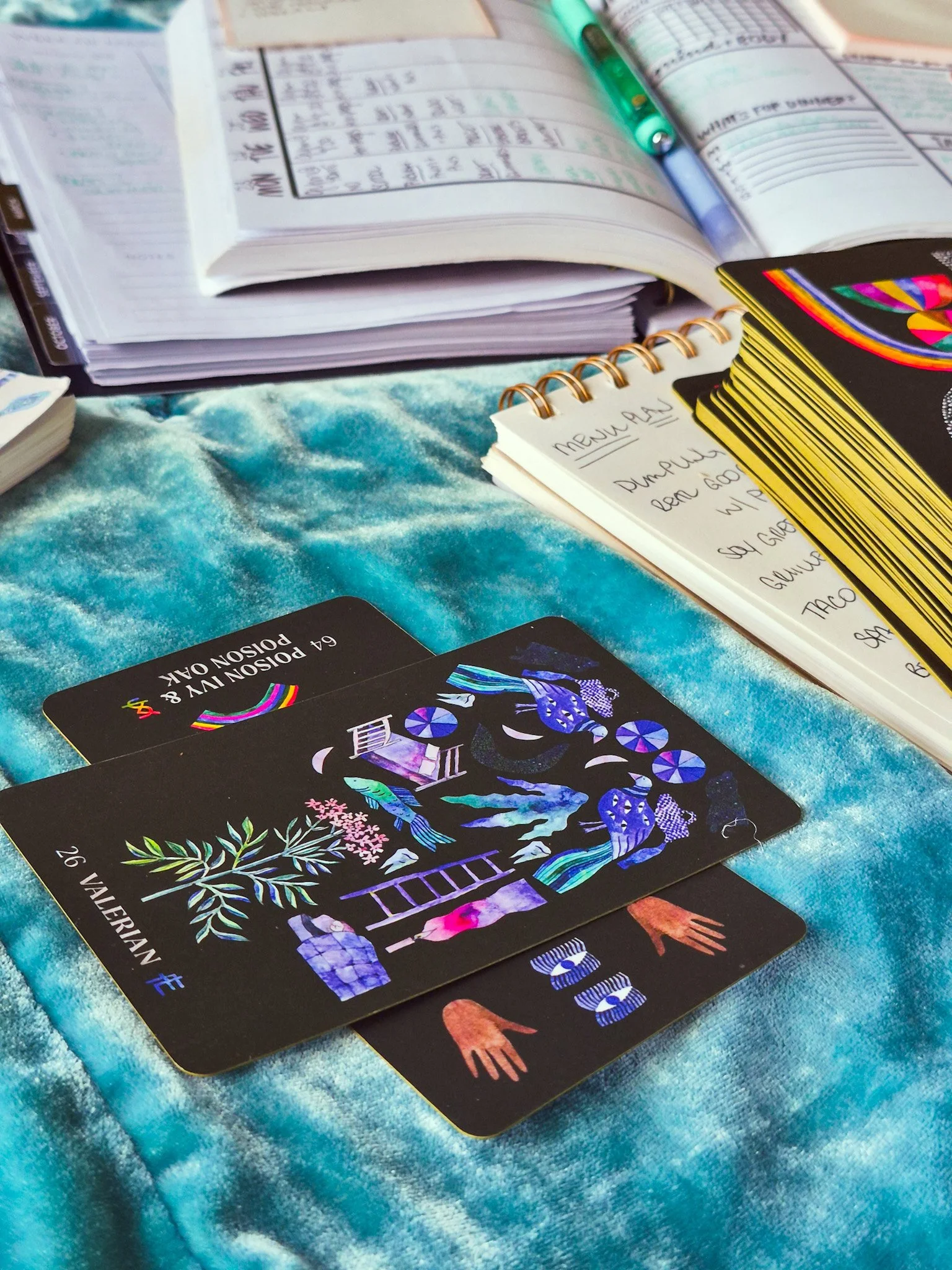 close up of Dirt Gems tarot cards next to other planning supplies