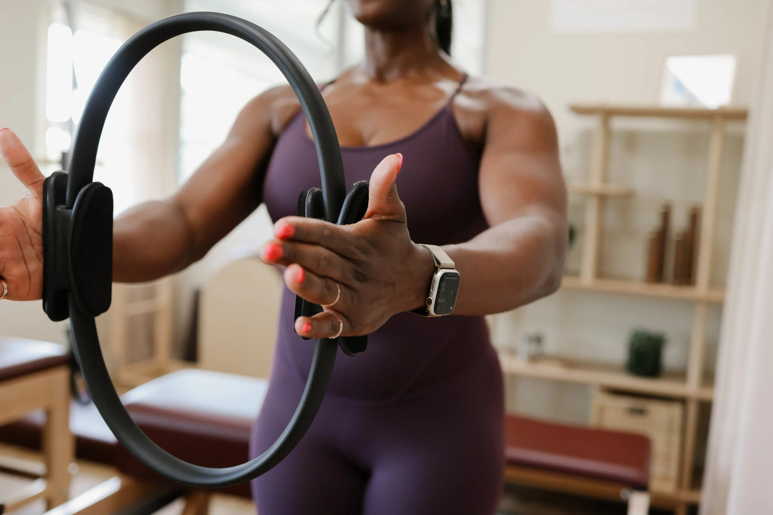 Classical Pilates exercise with the Magic Circle at FUNLAYO Pilates studio.
