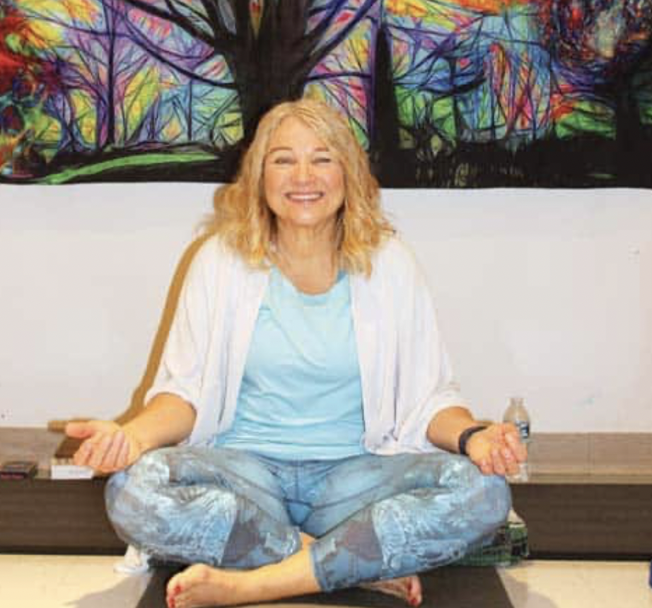 Picture of Maggie Spaulding teaching a yoga class