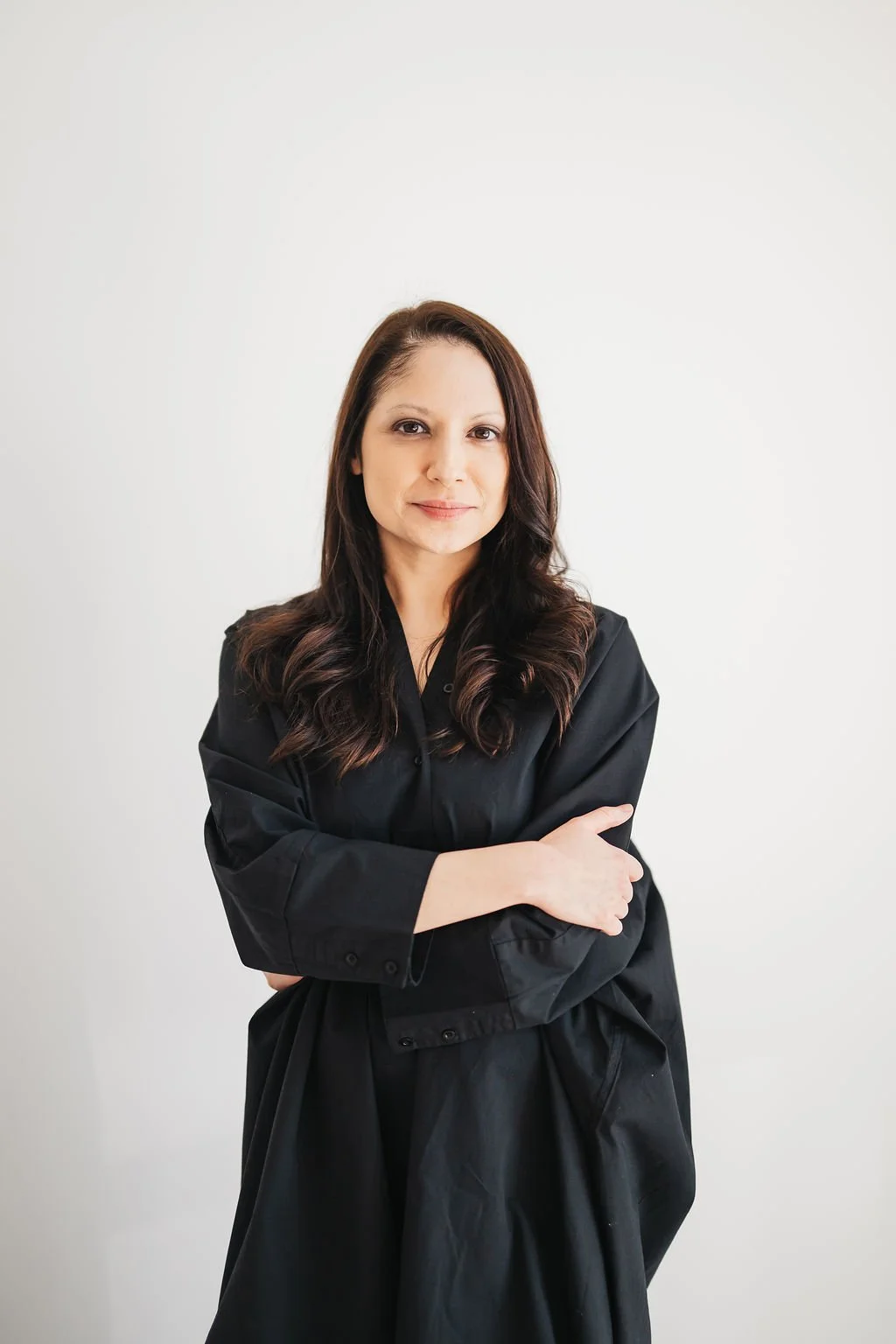 Woman in black dress smiling