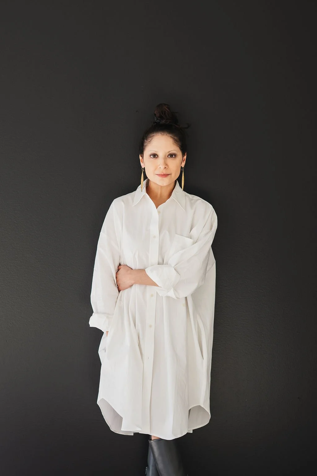 Photo of woman in white dress smiling