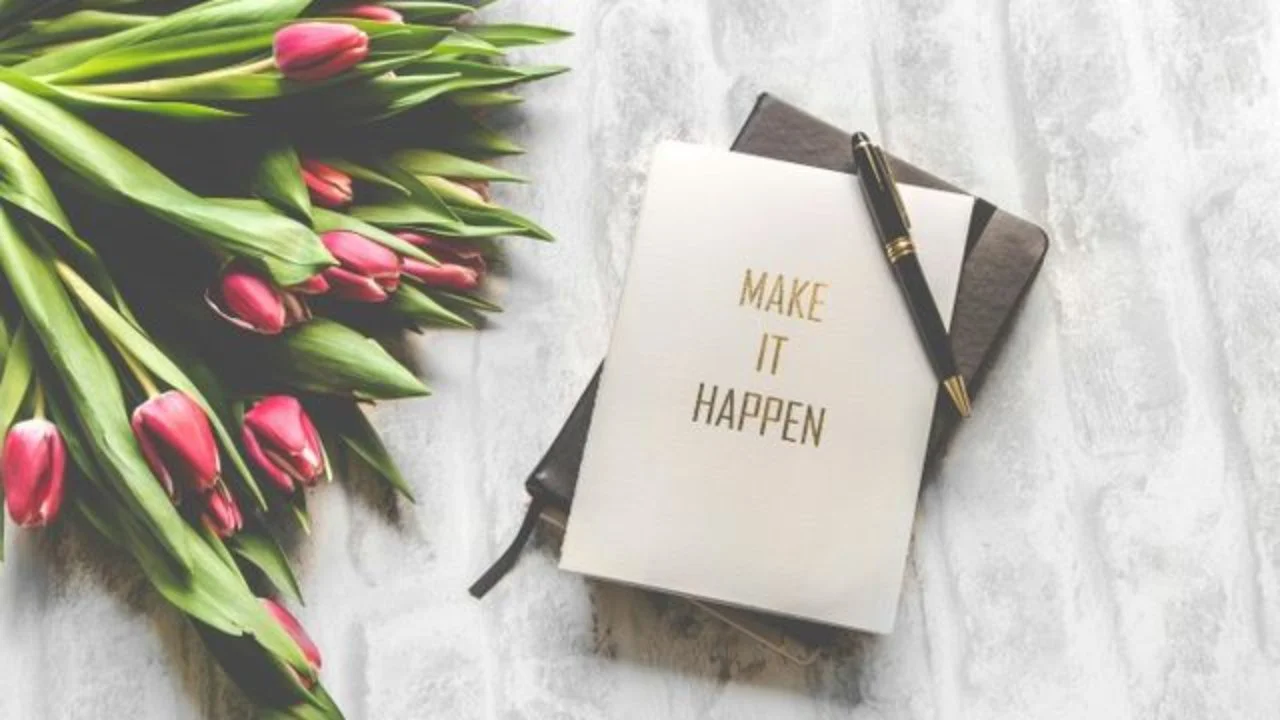 journal on a table with tulips