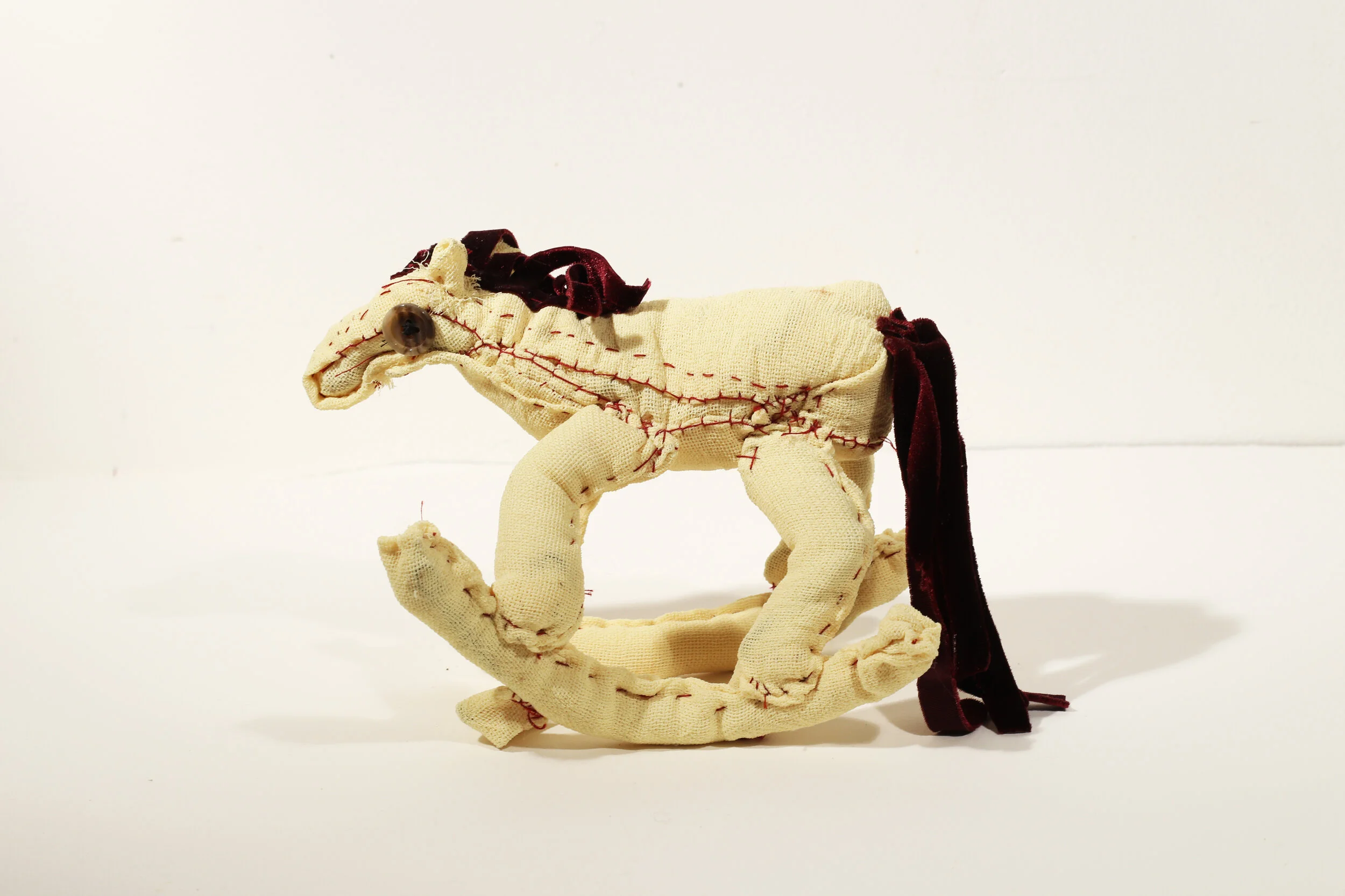 Rocking Horse, 2011, Wire, Fabric, Embroidery Floss, Thread, Buttons, 6" x 2.5" x 6.5", $600