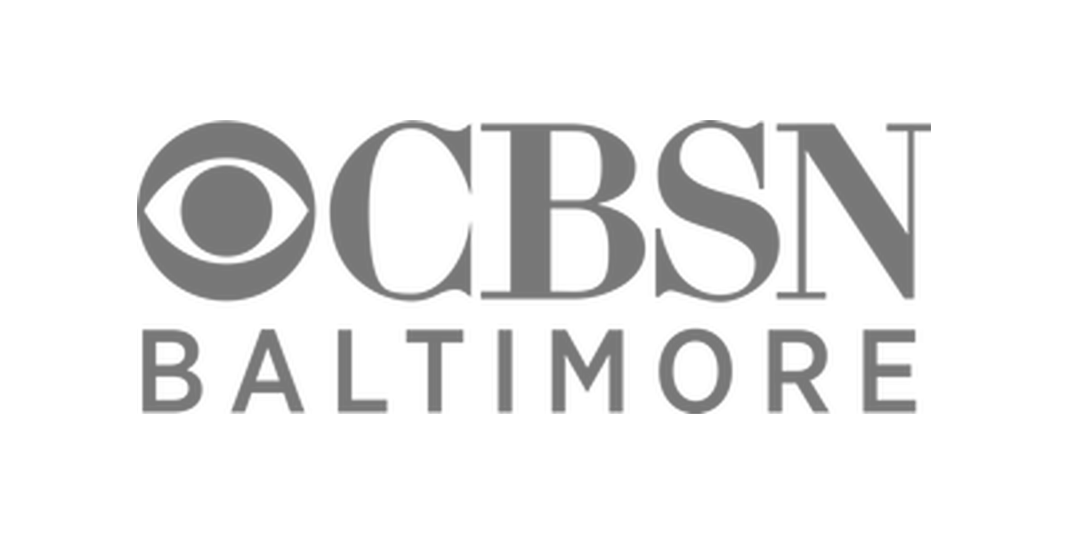 CBSN Baltimore logo with a circular icon and bold text