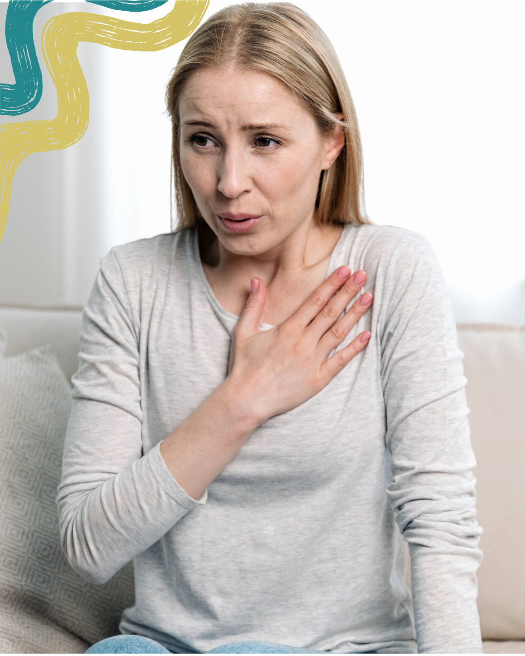 A woman with blonde hair and a gray long-sleeve shirt holding her hand to her chest, appearing to have difficulty breathing or experiencing discomfort.