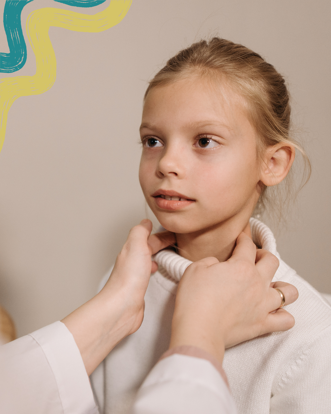 A young girl is having her neck examined or checked by a healthcare professional.