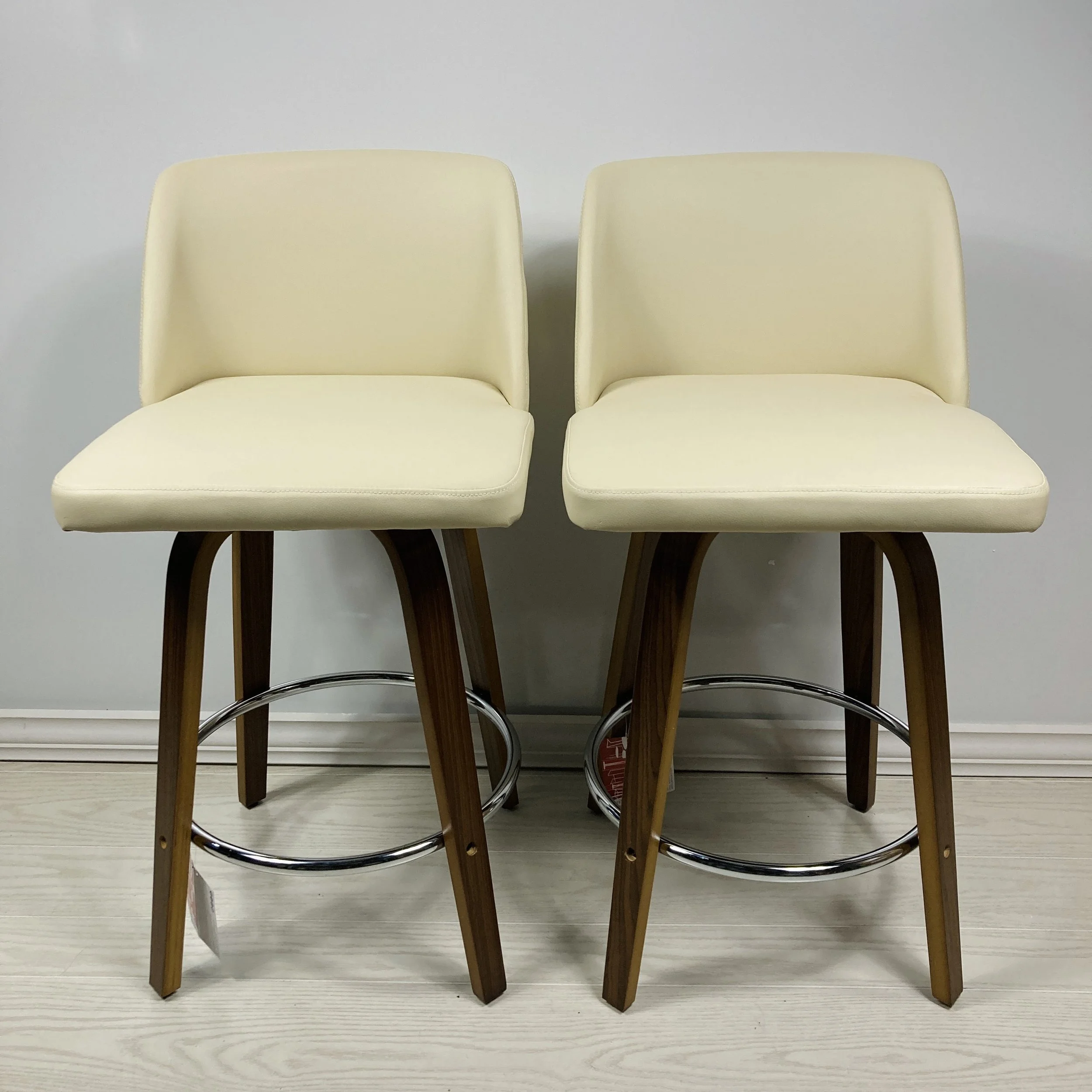 toriano-swivel-24-25-26-inch-counter-stool-bar-stool-cream-faux-leather-walnut-wood-chrome-footrest-front-view.JPG