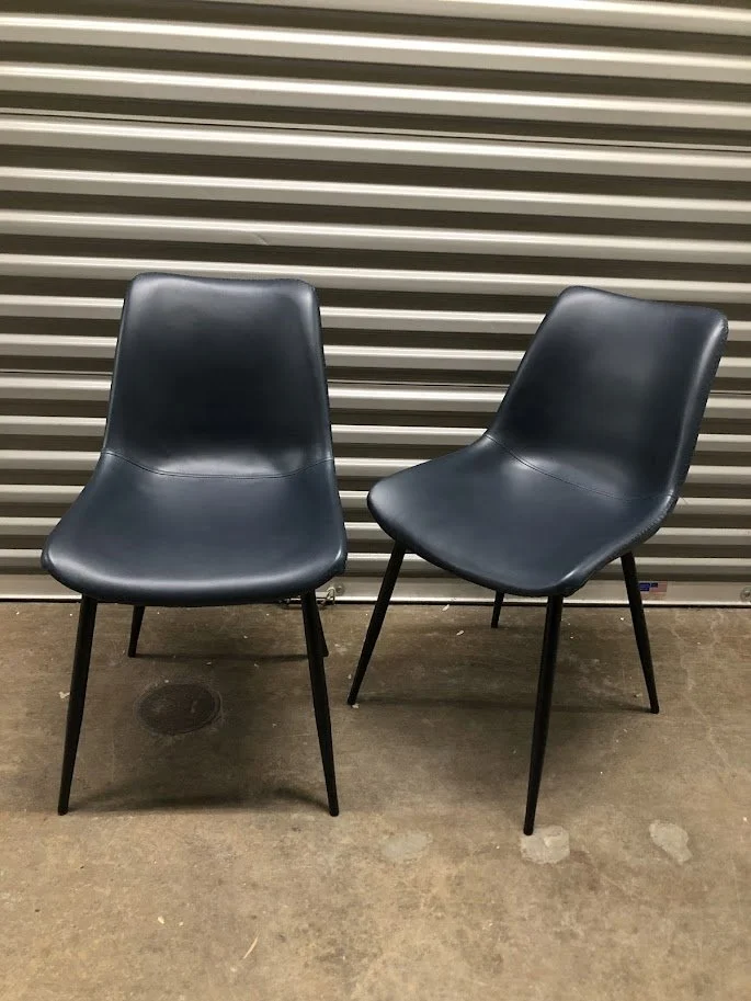 Close up of navy blue faux leather seat on Durango dining chair