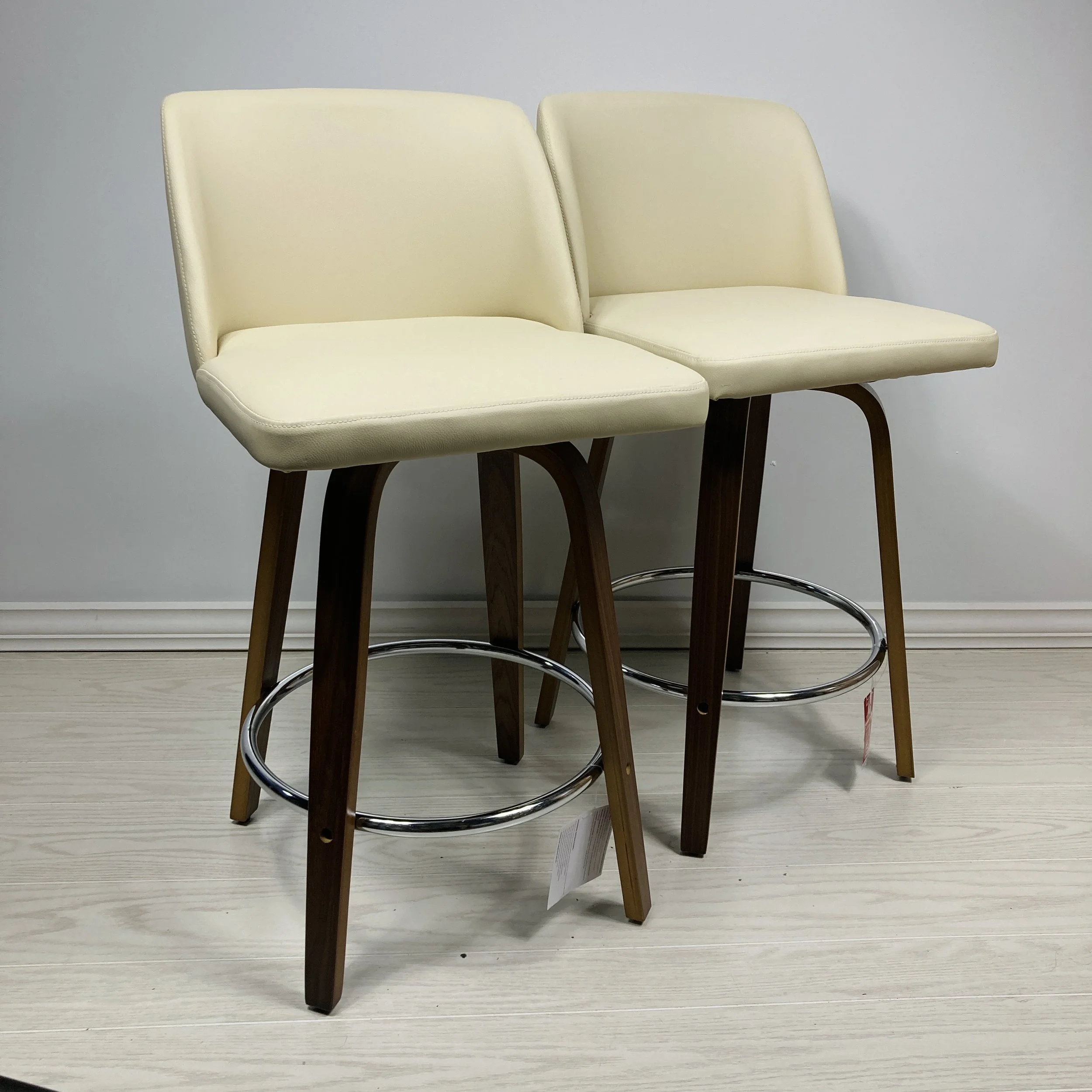 toriano-swivel-24-25-26-inch-counter-stool-bar-stool-cream-faux-leather-walnut-wood-chrome-footrest-side-by-side.JPG