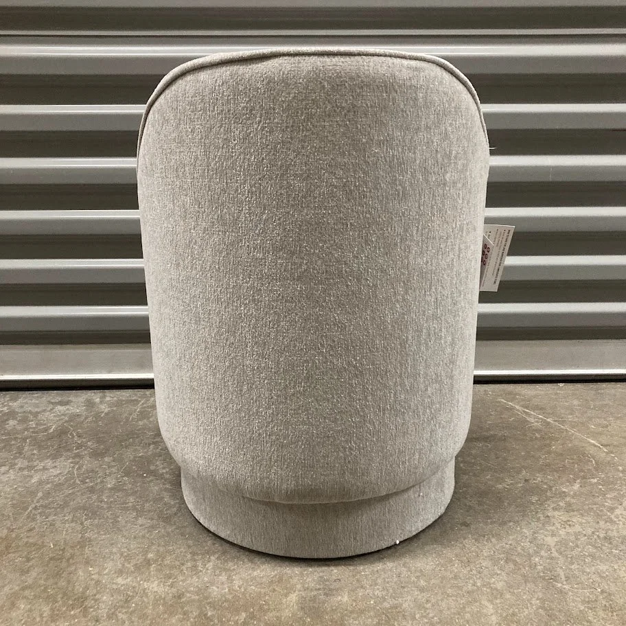 grey upholstered vanity stool with curved backrest