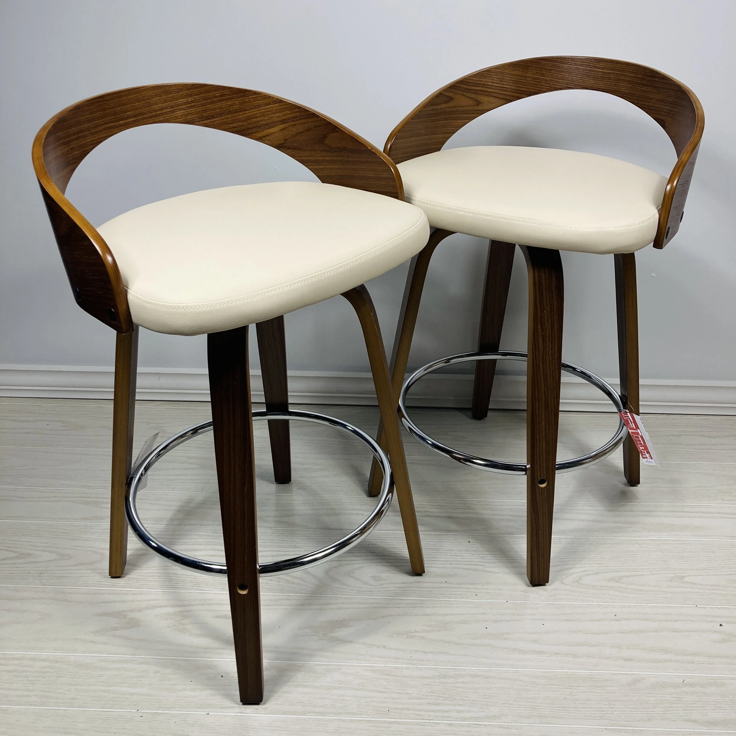 grotto-counter-stools-24-25-26-inch-walnut-wood-cream-faux-leather-chrome-footrest-lifestyle.JPG