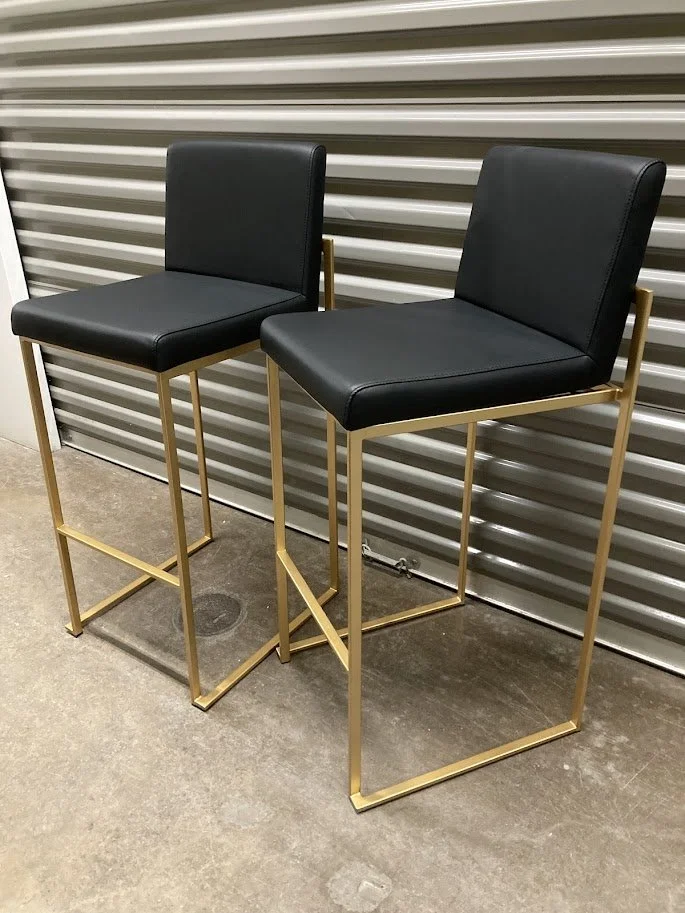 Close up of black faux leather seat on LumiSource Fuji bar stool