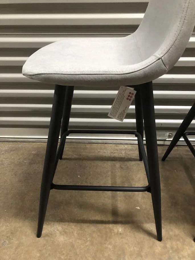 Black metal leg and footrest detail on LumiSource Pebble counter stool