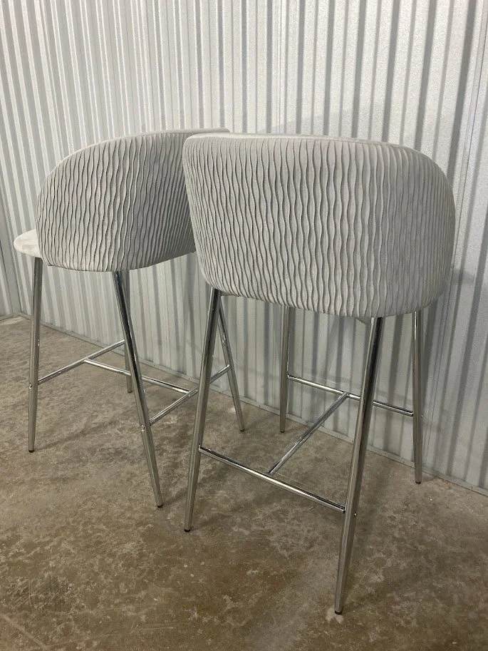 Close up of silver velvet padded seat on Fran counter stool