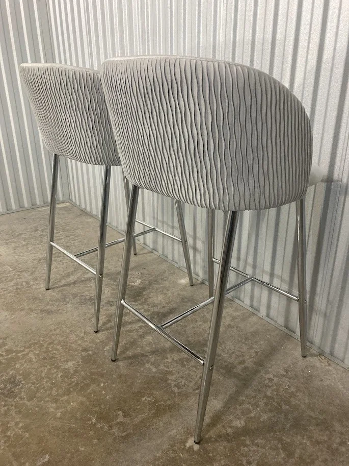 Side profile of LumiSource Fran silver velvet counter stool