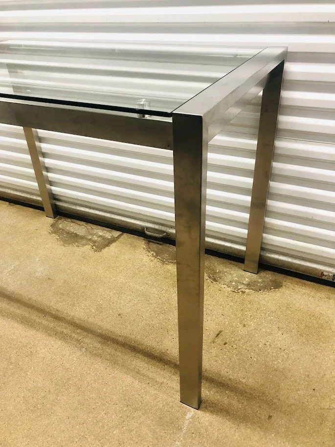 Stainless steel frame base on modern glass counter height table
