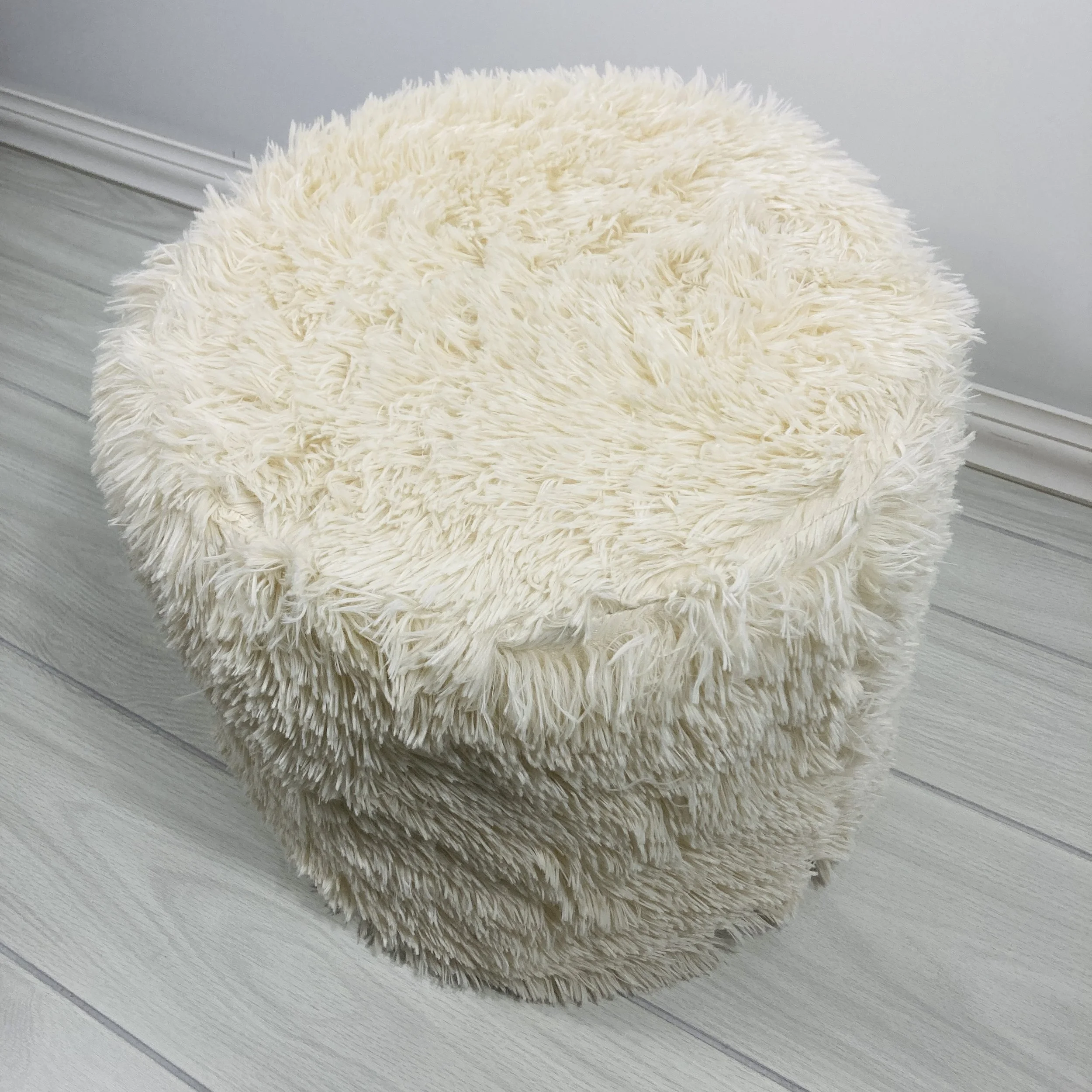 BEIGE-FAUX-FUR-UPHOLSTERED-ROUND-POUF-TOP-VIEW.JPG